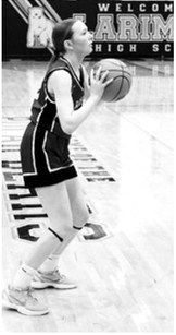 FM Bank Player of The Game Ary Shaefer drains a three-point basket and finished the win over Hatton-Northwood with 19 points. Photo by Larry Stokke
