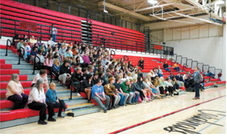 North Dakota State Superintendent Levi Bachmeier speaks in front of students. Photo by Larry Stoke