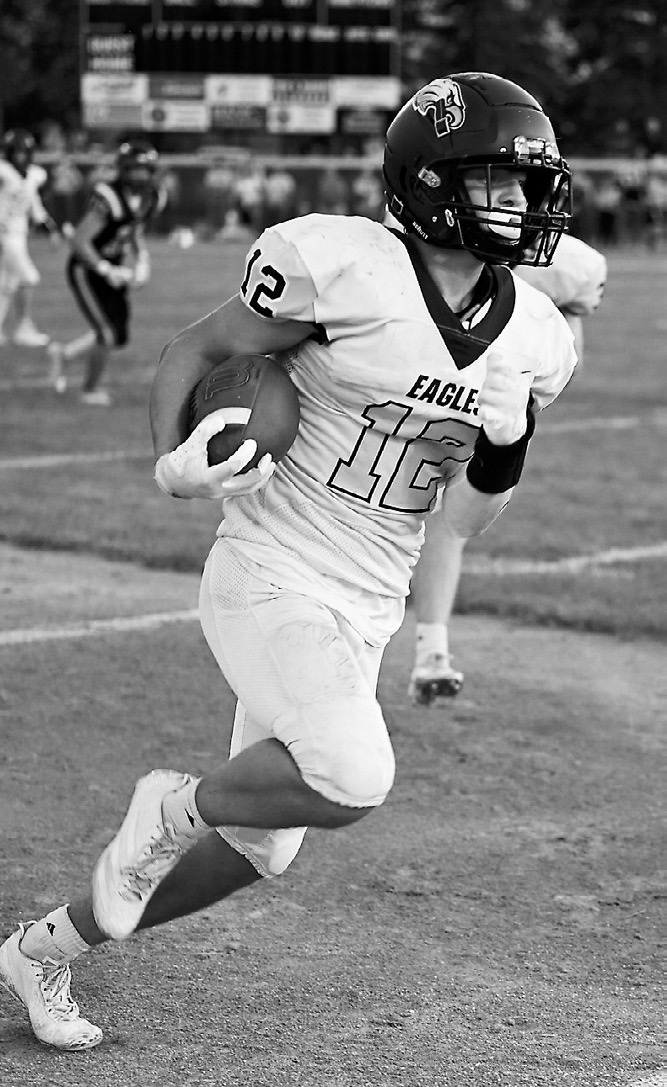 Weston Cosley turns on the speed to pick up yardage downfield.