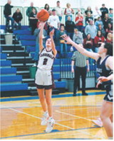 Mya Swanson drains a basket in the Cards win over North Prairie. Photo by Larry Stokke