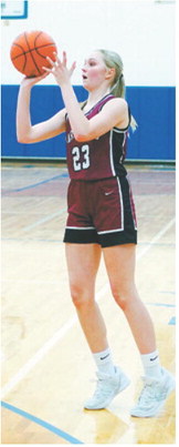 Hallie Overby drains a 3-point shot at the District 4B Tournament. Photo by Larry Stokke