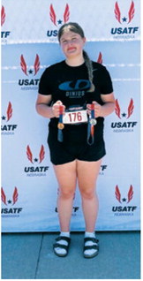Fenja Lawson of Langdon displays the medals she earned at the 2026 USATF Region 8 Junior Olympics in Gretna, Neb. Lawson placed second in the discus with a throw of 40.19 meters to qualify for the 2026 USATF National Junior Olympic Track &amp; Field Championships in Norwalk, Calif. She also finished sixth in the shot put while competing for the Dinius Track and Field Club. Submitted photo