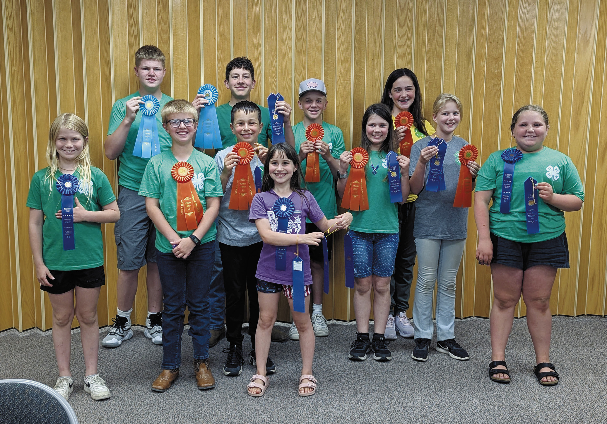 Front row (L-R): Sadie Halverson, Levi Norrell, Nathan Stegman, Olive Truver, Chloe Hunter, Stella Norrell, Lainy Shane; back row: Chaz Halverson, Chris Longtin, Spencer Berg, and Naomi Stegman.