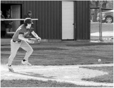 Levi Swanson with a bunt to advance his teammate. Photo by Larry Stokke.