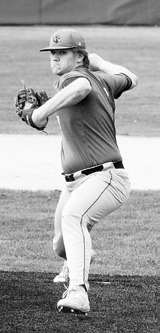 Theo Romfo eyes the strike zone and hurls one right across for a strike against Grafton. Photo by Larry Stokke.