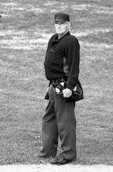 The man, the myth, the legend - Langdon’s Tom Perius - was behind the plate in his 54th year of calling balls and strikes. Photo by Larry Stokke.