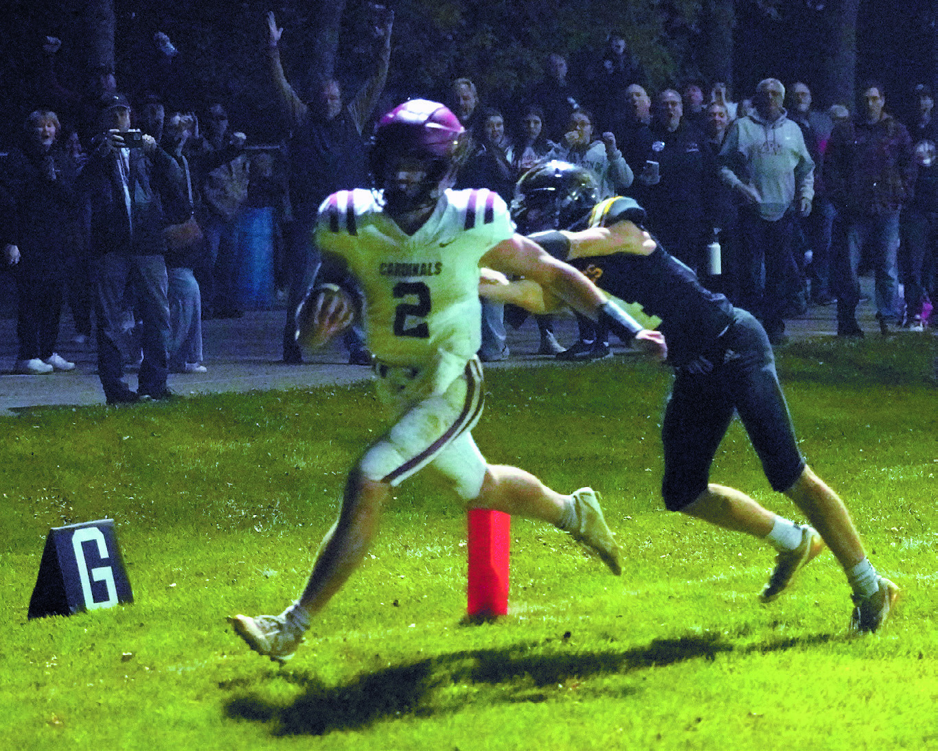 Jax Johnson runs in a touchdown, finishing the game with 112 rushing yards and three touchdowns. Photo by Larry Stokke.