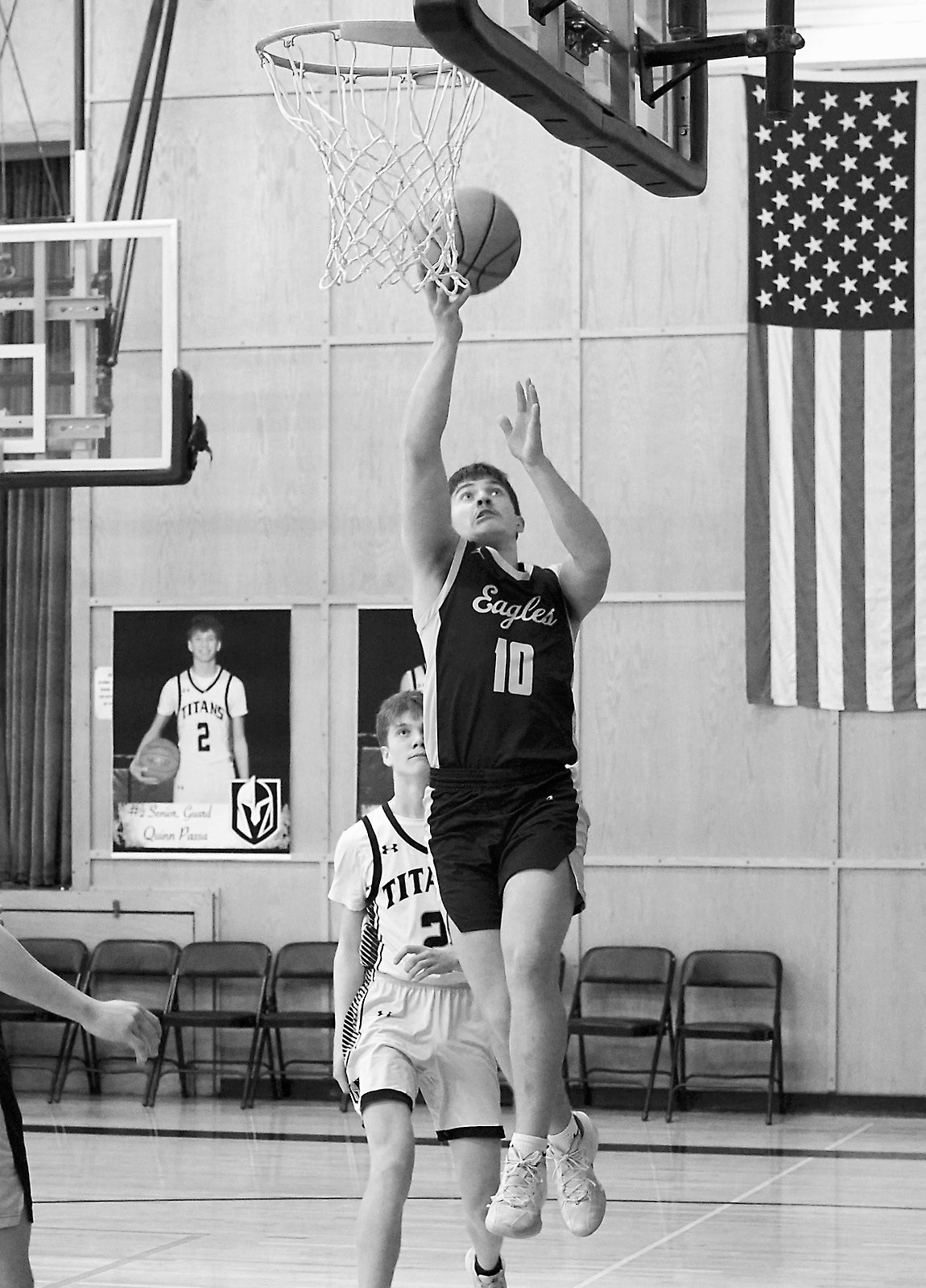 Colton Baily adds two points to the Eagles win over the Titans. Photo by Larry Stokke.