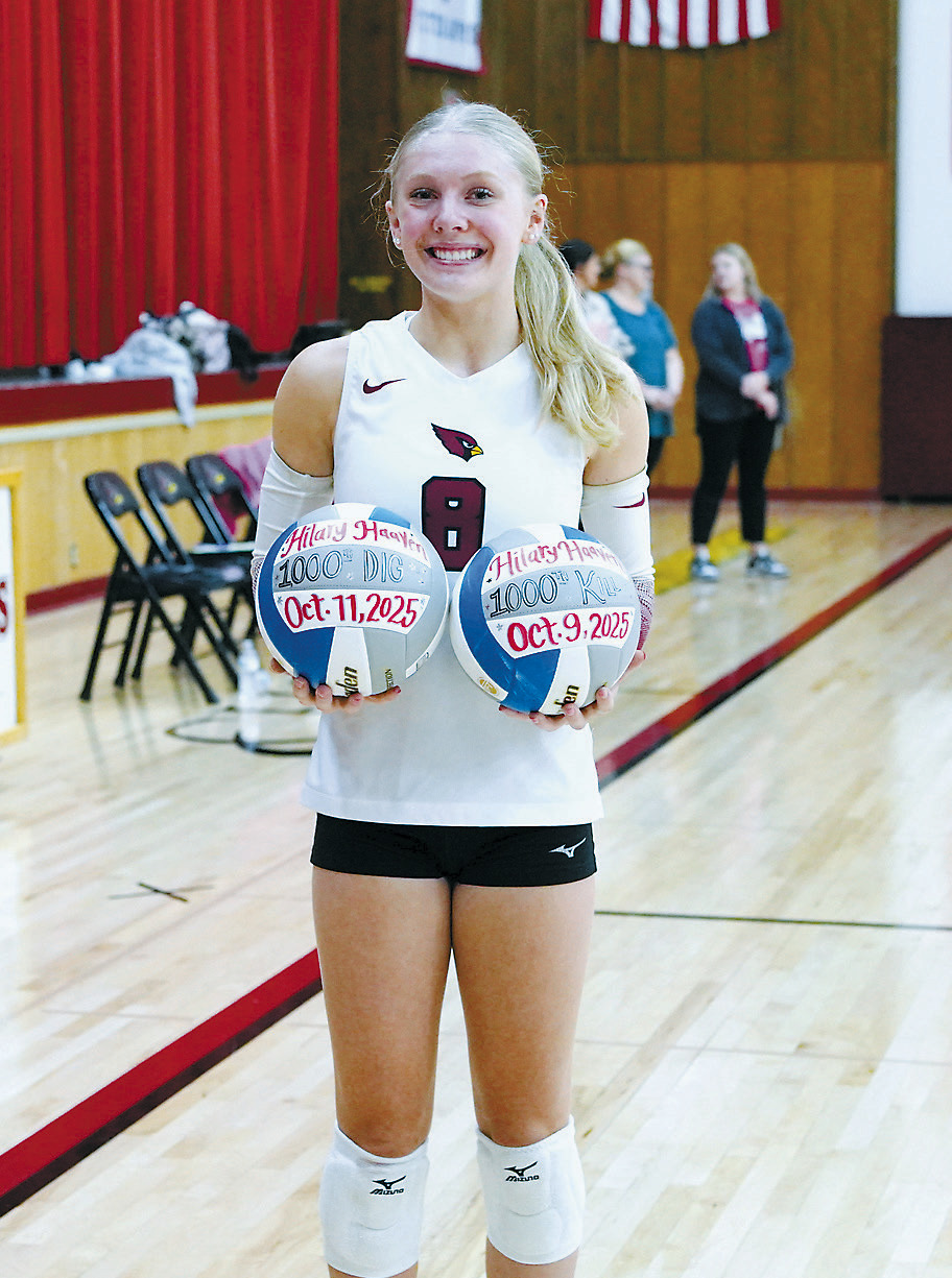 Lady Cards freshman Hilary Haaven did something that's been reported as unprecedented in North Dakota volleyball - she reached 1,000 career kills and 1,000 career digs as a freshman. She was presented with two game balls for this accomplishment on Oct. 14. Read more about Haaven and the Cardinals girls volleyball team on Pg. B2. Photo by Larry Stokke.