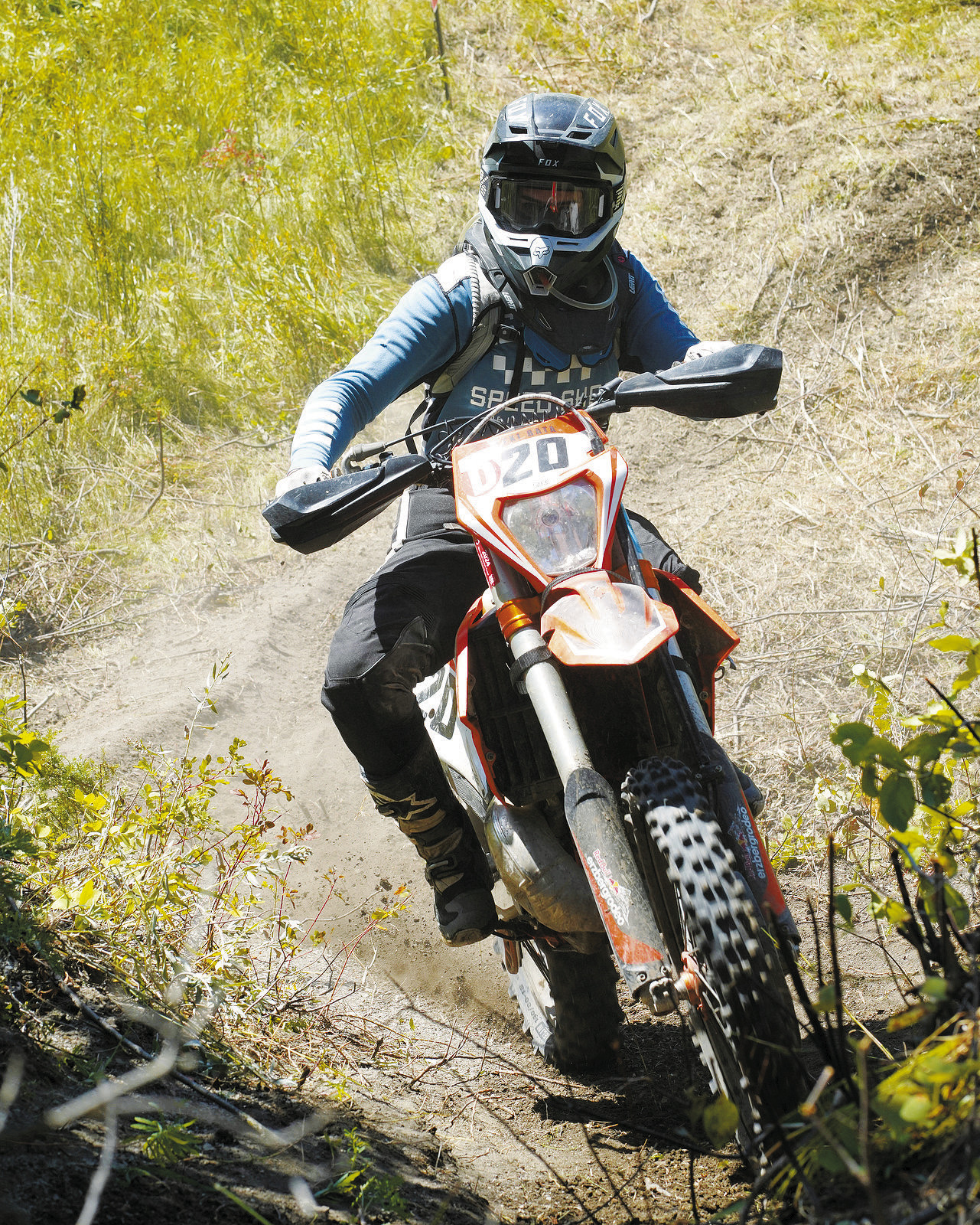 Lexi Bata flies up the steep hill at the Hare Scramble. Photo by Larry Stokke.