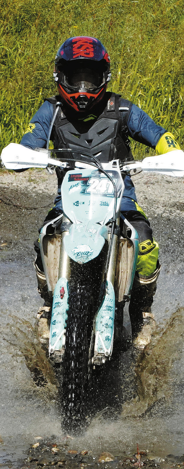 Lawrence Scharneck crosses the water at the Hare Scramble. Photo by Larry Stokke.