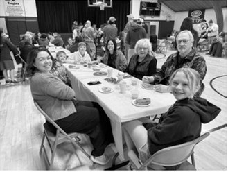 Community in Action hosts Donuts With Grownups at Pembina School