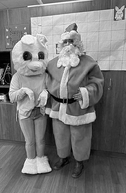 The Easter Bunny (Kelsey) and Santa (Heather) pose for a photo!