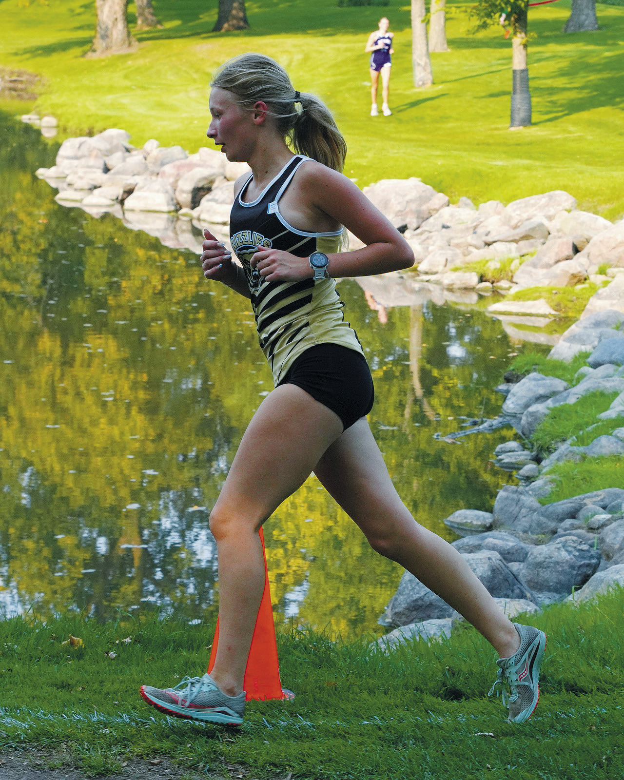 Emersen Helgoe had a great run at the Larimore Meet. Photo by Larry Stokke.