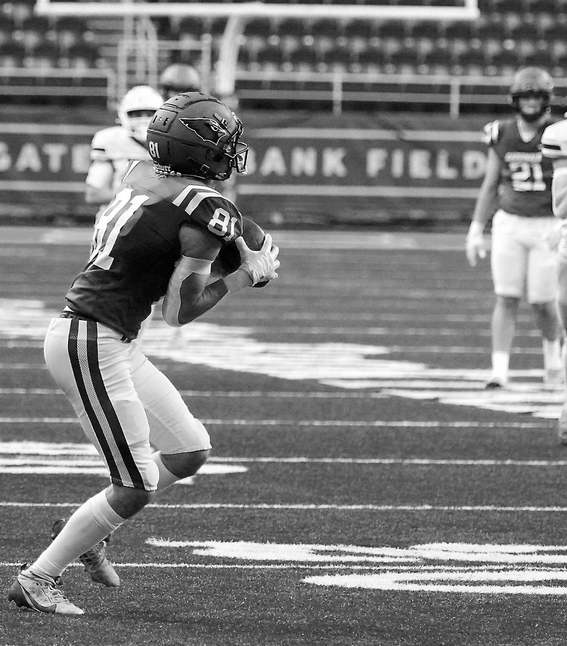 Tanner McDonald with a great reception which resulted in a touchdown for the Cards in their win over Bottineau to take home the state championship. Photo by Larry Stokke.