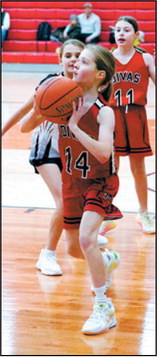 Breck Krivarchka drops ball in the hoop at the 3rd Annual Sports Boosters Tournament. Photo by Larry Stokke