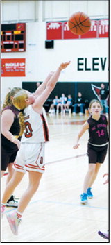 Kalleigh Rollness puts up a shot from beyond the free throw line. Photo by Larry Stokke