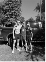 Three generations of Simmons at the Mt. Carmel 5K. From left are shirtless son Drew, patriarch Bob and grandson Prestyn.
