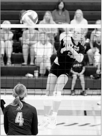 Langdon Area-Munich’s Hilary Haaven delivers a kill against Park River during a scrimmage Saturday, Aug. 22, in Thompson. Photo by Larry Stokke
