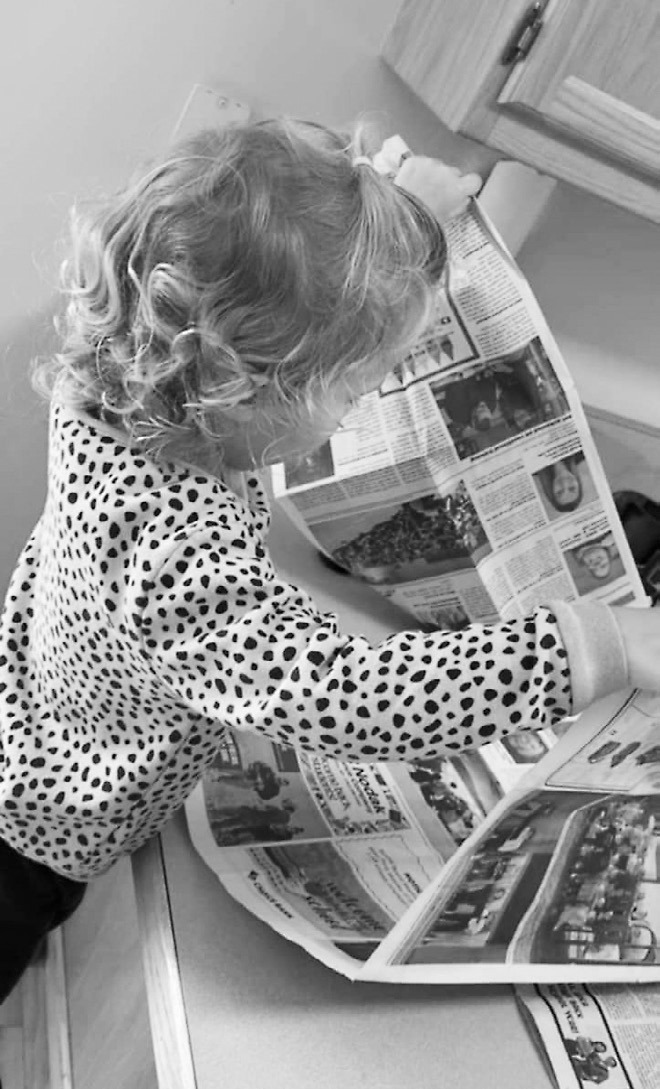 Rosie loves looking for photos in the paper every week.