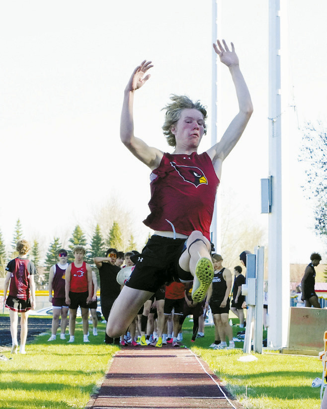 Caleb McDonald took 3rd in the long Jump with a distance of 20'.5'. Photo by Larry Stokke.
