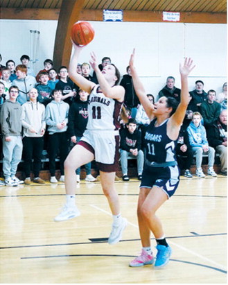 FM Bank Player of the game Erika Bakke lays in two of her 13 points in the Lady Cards win over