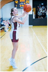 Kemi Morstad drops one in the basket from the 3-point line when the Lady Cards beat the North Prairie Cougars in Munich. Photo by Larry Stokke