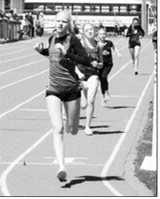 Mya Swanson placed second in the 1,600-meter run at the Hillsboro meet on April 25. Photo by Larry Stokke.