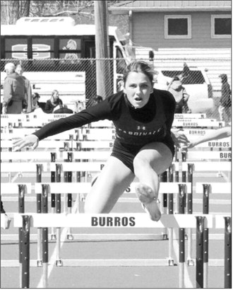 Co-Performer of the Meet Meggy Hetletved recorded a personal-best, state-qualifying time of 16.79 to place second in the 100-meter hurdles at the Hillsboro meet. Photo by Larry Stokke.