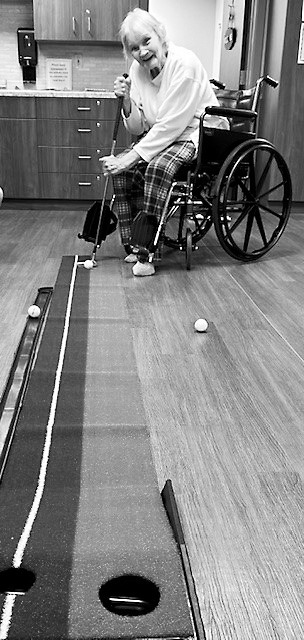 Joann (Braget) Woods golfing.