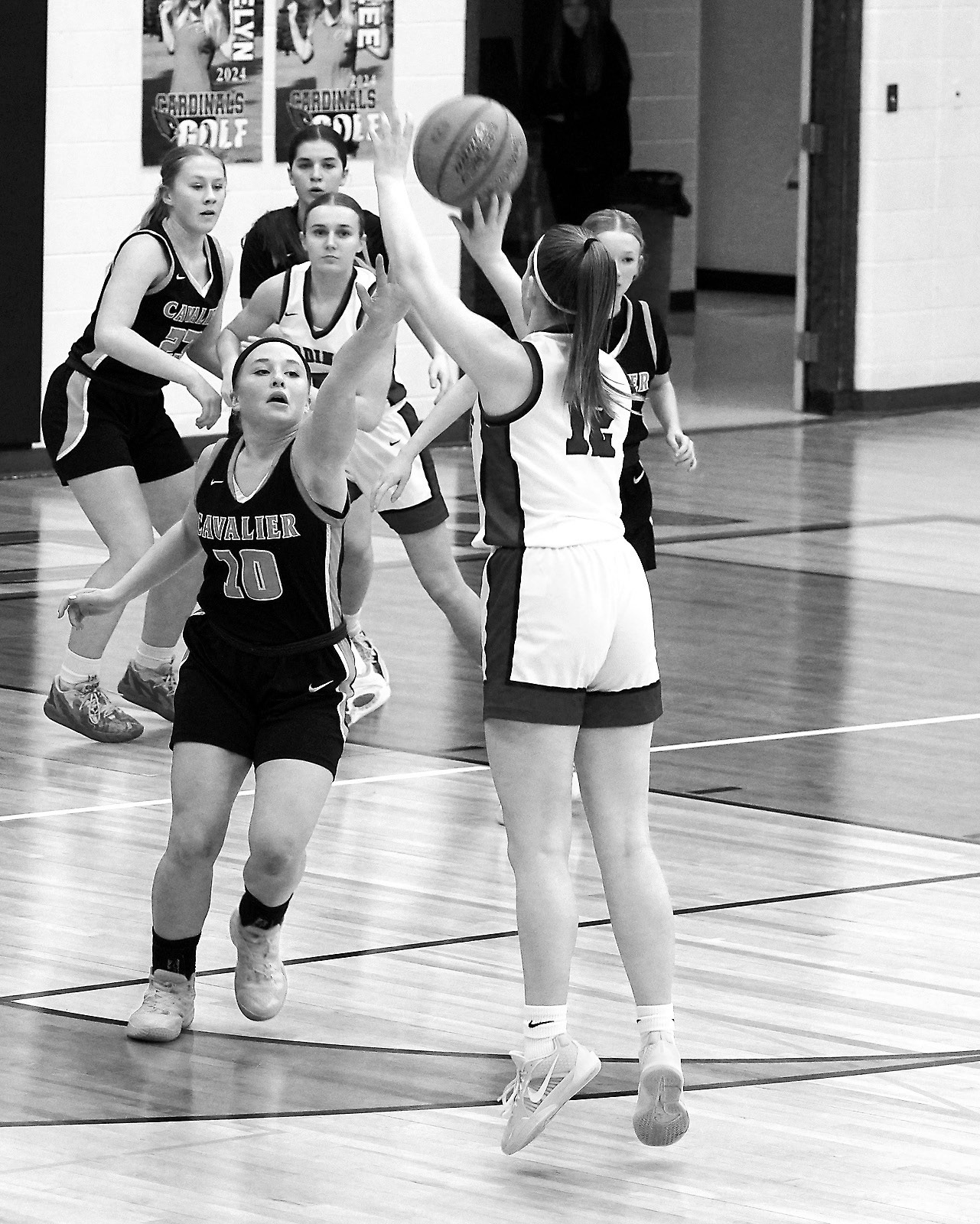 Mikaela Olson dropped in two 3-point baskets to add to the Cards' 62-point game over the Tornadoes. Photo by Larry Stokke.