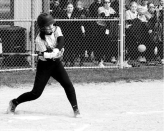 Averie Sondeland keeps her eye on the ball before connecting on a hit to the outfield. Photo by Larry Stokke