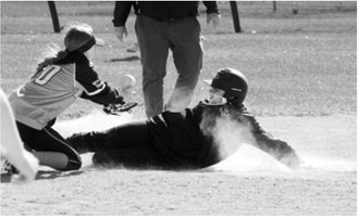 Colby Forest slides safely into second base during the Cardinals’ come-from-behind win over Midway/Minto on May 12 in Langdon. Photo by Larry Stokke
