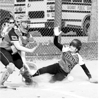 Lily Zimmer slides into home base. Photo by Larry Stokke
