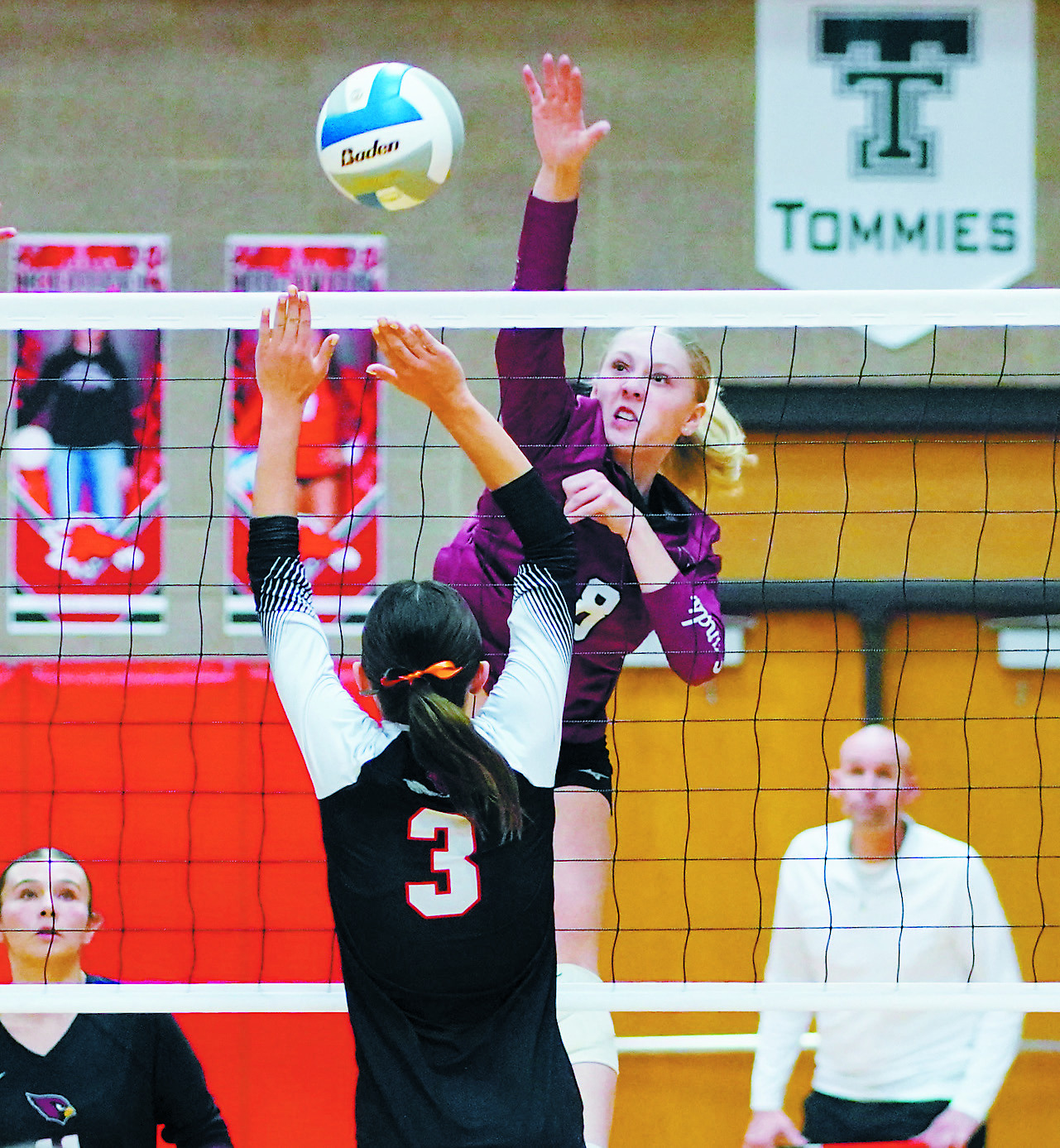 Hilary Haaven slams down a kill at regionals in Devils Lake against the Cavalier Tornadoes. Photo by Larry Stokke.