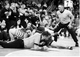 Jaelyn Forrey pins her girl and finished the tournament with a 7th place finish at the Rumble on the Red in Fargo on Jan. 3. Photo by Larry Stokke.