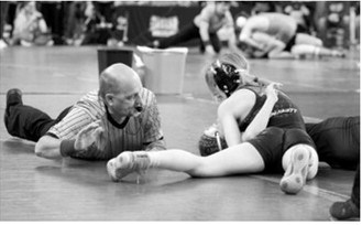 In the 118 pound weight class Dannika Bennett took home a 3rd place finish by pinning her opponent. Photo by Larry Stokke.