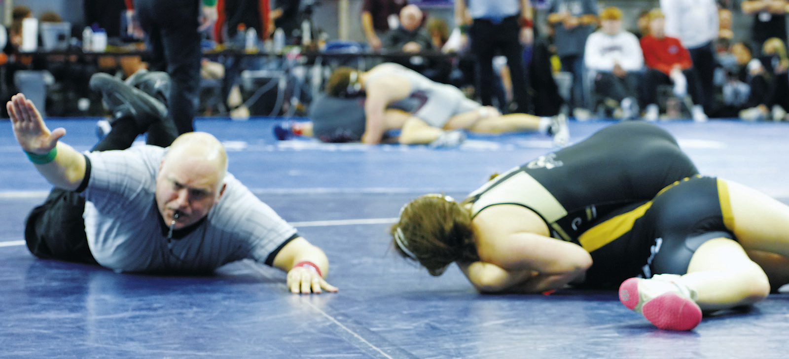 Ava Kemnitz pins her opponent in the 142 lbs. weight class at state. Photo by Larry Stokke.