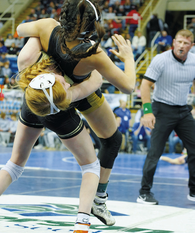 Charlotte Crowston powers her opponent off her feet and wins by pinfall on the way to a 2nd place finish at state. Photo by Larry Stokke.