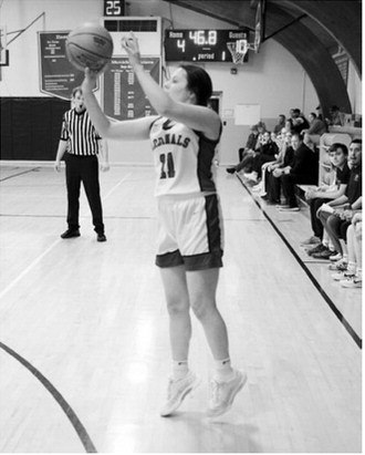 Erika Bakke drains a 3-point shot at the end of the first quarter against St. John in Munich on Jan. 12. Photo by Larry Stokke.
