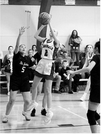 Mya Swanson had a team-high 11 points in the overtime win over the Woodchucks. Photo by Larry Stokke.