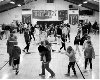 The Munich 7th grade class held a cake walk fundraiser after the game against St. John. Photo by Larry Stokke.