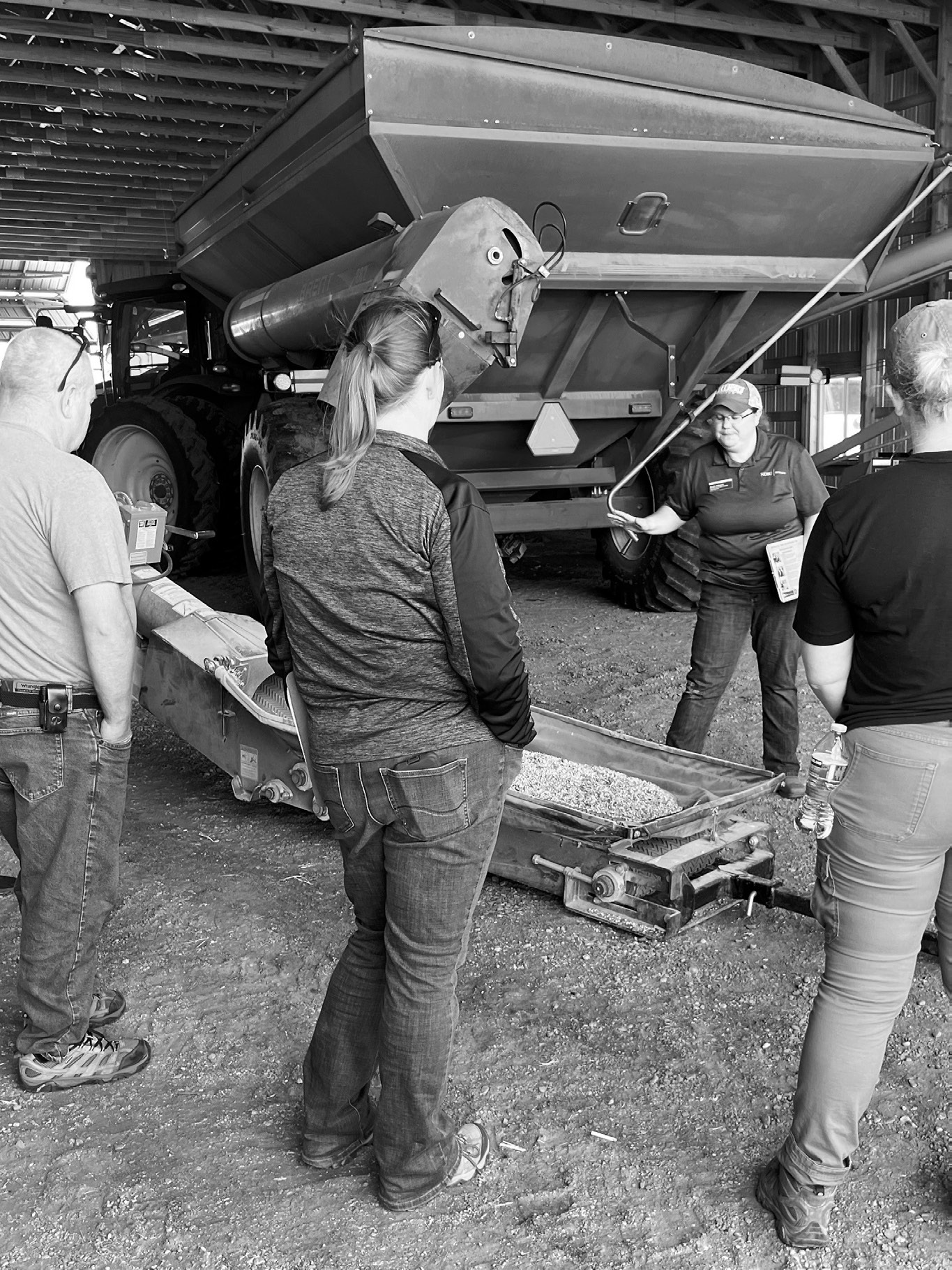 Angie Johnson, NDSU Extension farm and ranch safety specialist, explains safety procedures around an auger. (NDSU photo)