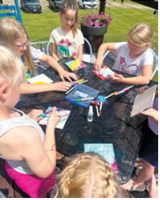 Campers create colorful artwork during the Encore Arts Camp at Frost Fire Park. Sixty- eight students participated in the weeklong program, which concluded with a public art showcase. Submitted photo