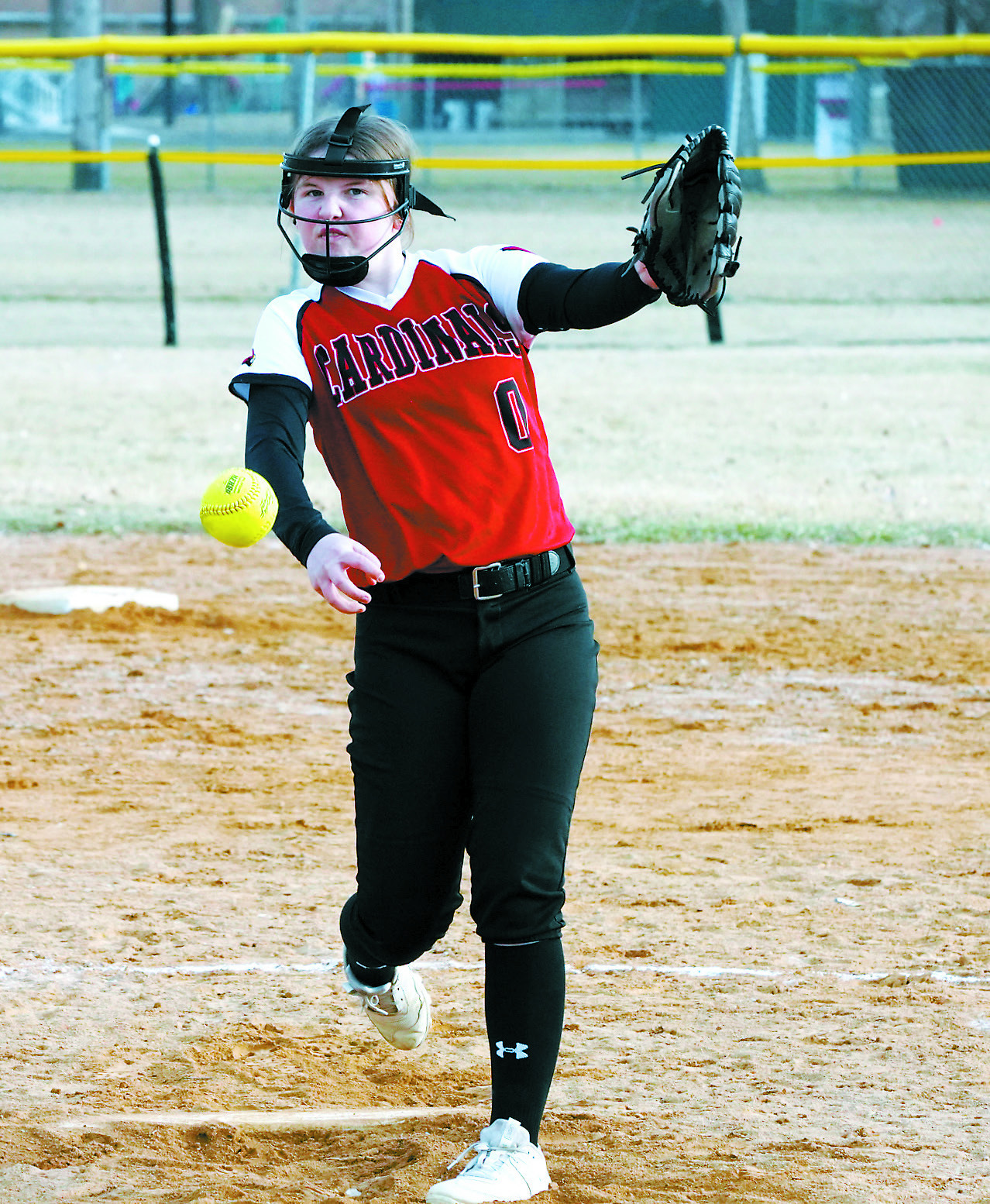 Nadia Lewis winds up and strikes out a Larimore batter in Langdon on April 24. Kadence Wirth with an 'I dare you to' look sends one to the batter. Photo by Larry Stokke. Photo by Larry Stokke.
