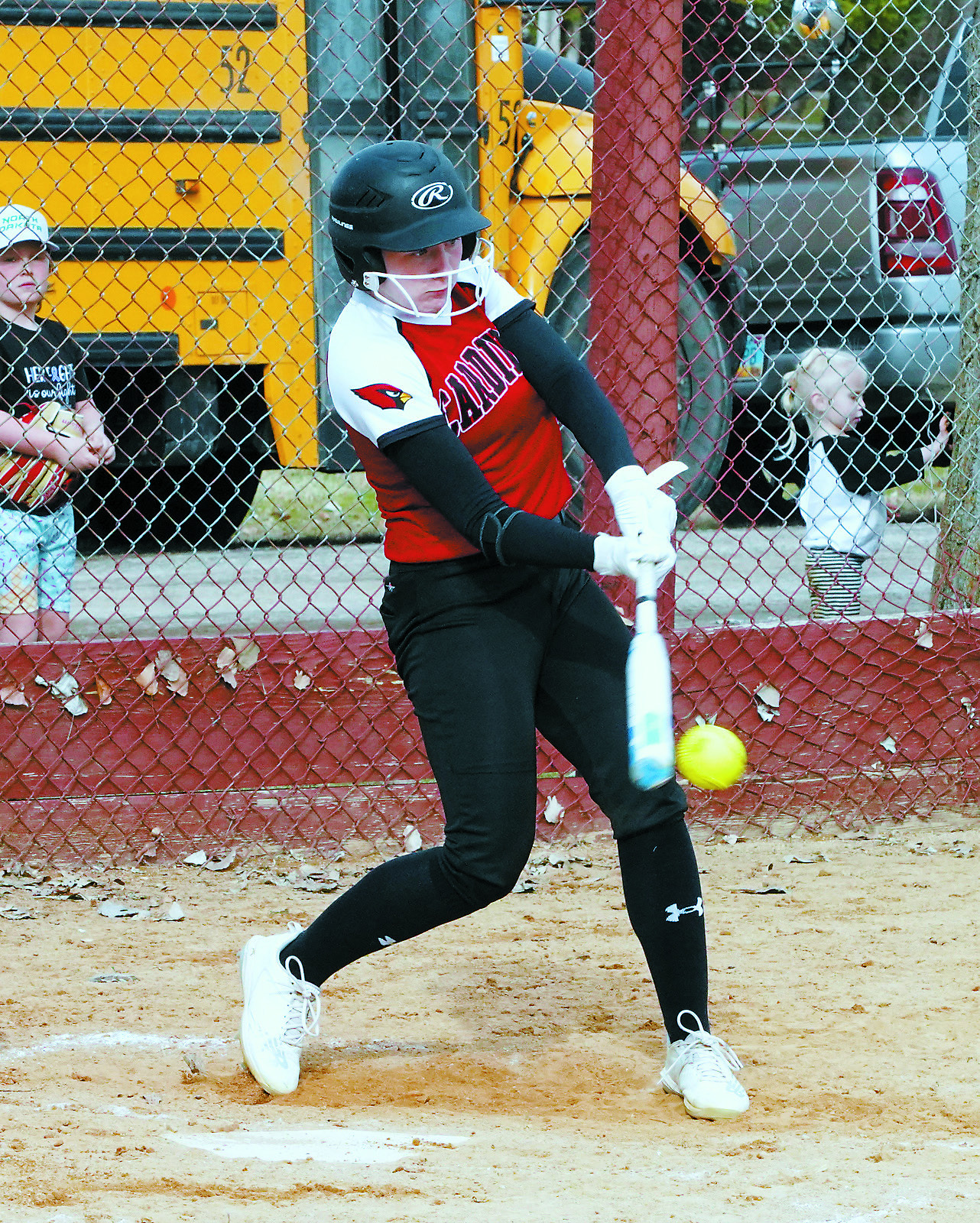 Meredith Romfo connects and sends the ball over the fence for a home run. Photo by Larry Stokke.