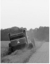 Following safe practices while mowing or haying roadway ditches can help prevent equipment damage and serious injuries. NDSU photo.