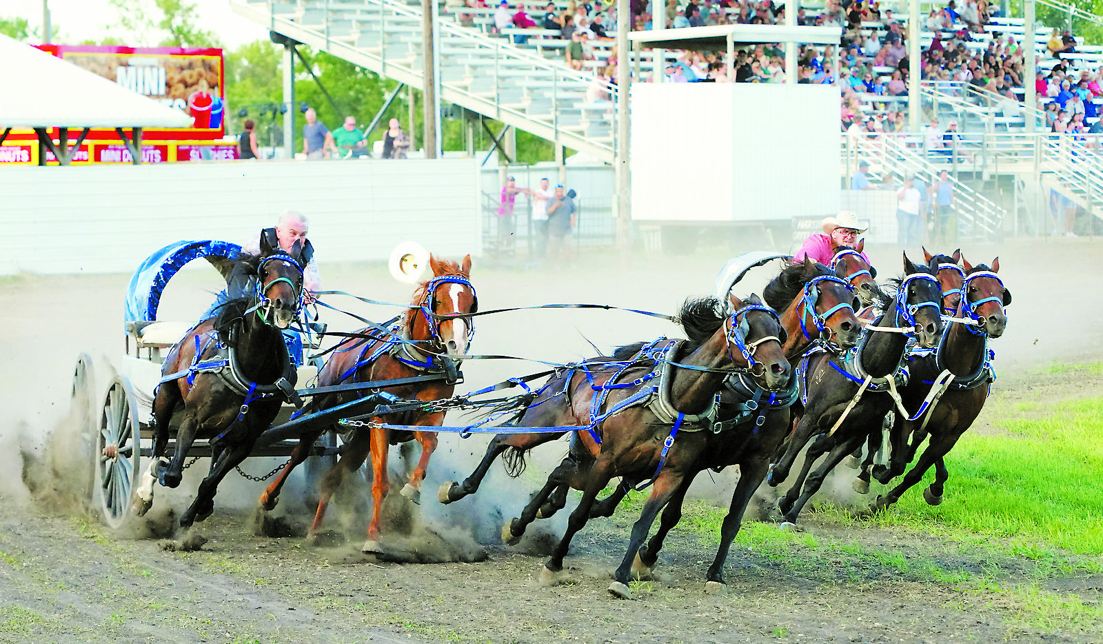 Dennis Robinson (left) takes on a curve against competitor Bryce Hartje (right). Photo by Larry Stokke.
