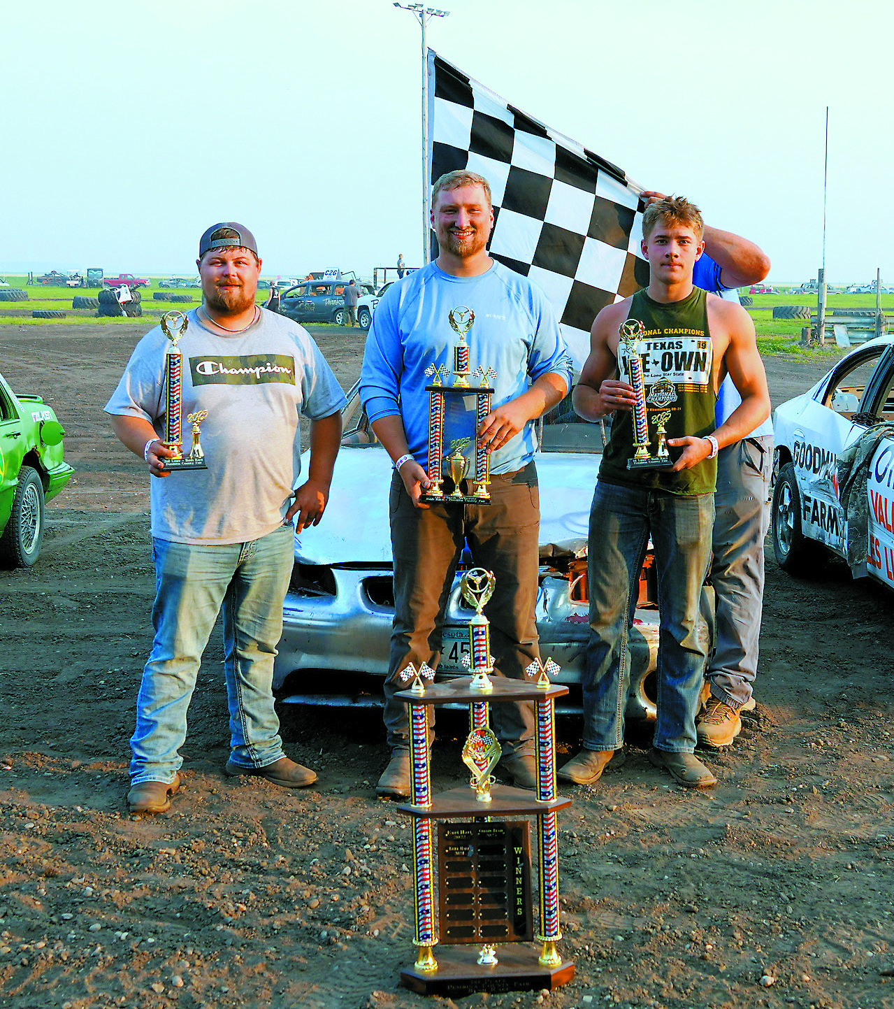 Bush Car Race champions (L-R) 2nd place- Brian Tollefson, 1st place- Hogan Lundgreen, and 3rd place Cole Carrier. Photo by Larry Stokke.