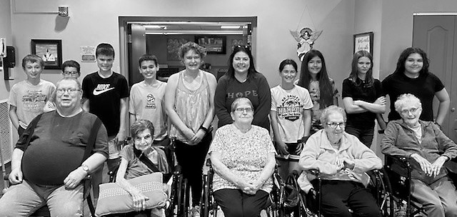 The crowd gathered for sixth grade movie day with PNC residents.
